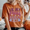 In My Muscle Mommy Era Groovy On Back Women's Oversized Comfort T-Shirt Yam