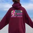 Never Underestimate A Woman Who Survived Breast Cancer Women Oversized Hoodie Back Print Maroon