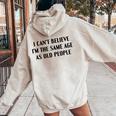 I Can't Believe I'm The Same Age As Old People Saying Women Oversized Hoodie Back Print Sand