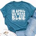 In April We Wear Blue Groovy Autism Awareness Bella Canvas T-shirt Heather Deep Teal