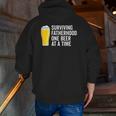 Mens Surviving Fatherhood One Beer At A Time Cool Fathers Day Zip Up Hoodie Back Print